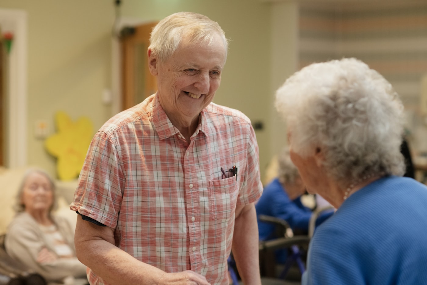 Older adults smiling and chatting together